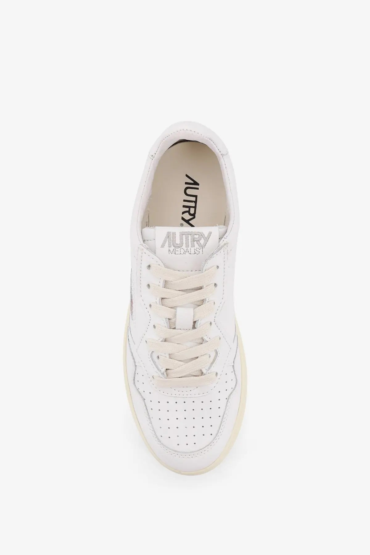 Autry women’s medalist leather sneaker in white with perforated detailing and cream-colored rubber sole