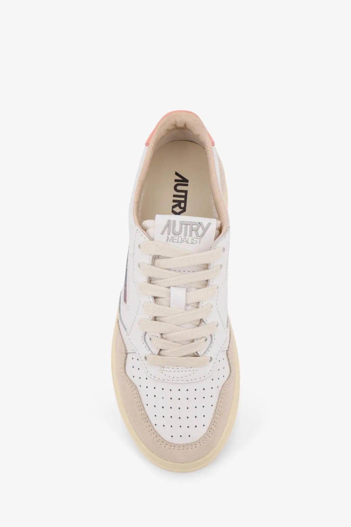 Autry women’s Medalist leather sneaker in white and beige perforated leather with a subtle pink heel tab accent