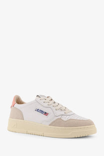 Autry women’s medalist leather sneaker in white with beige suede and subtle american flag logo on the side