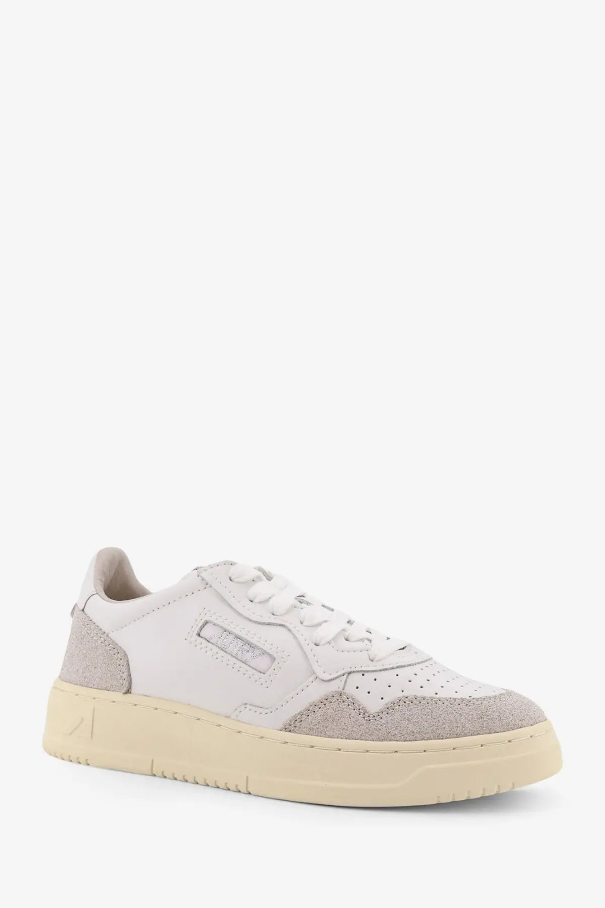 Autry women’s Medalist low leather sneakers in white and gray suede with cream-colored rubber sole