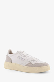 Autry women’s Medalist low leather sneakers in white and gray suede with cream-colored rubber sole