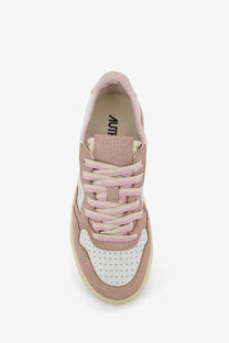 Autry women’s medalist low leather and suede sneaker in soft pink and white with perforated toe box detailing