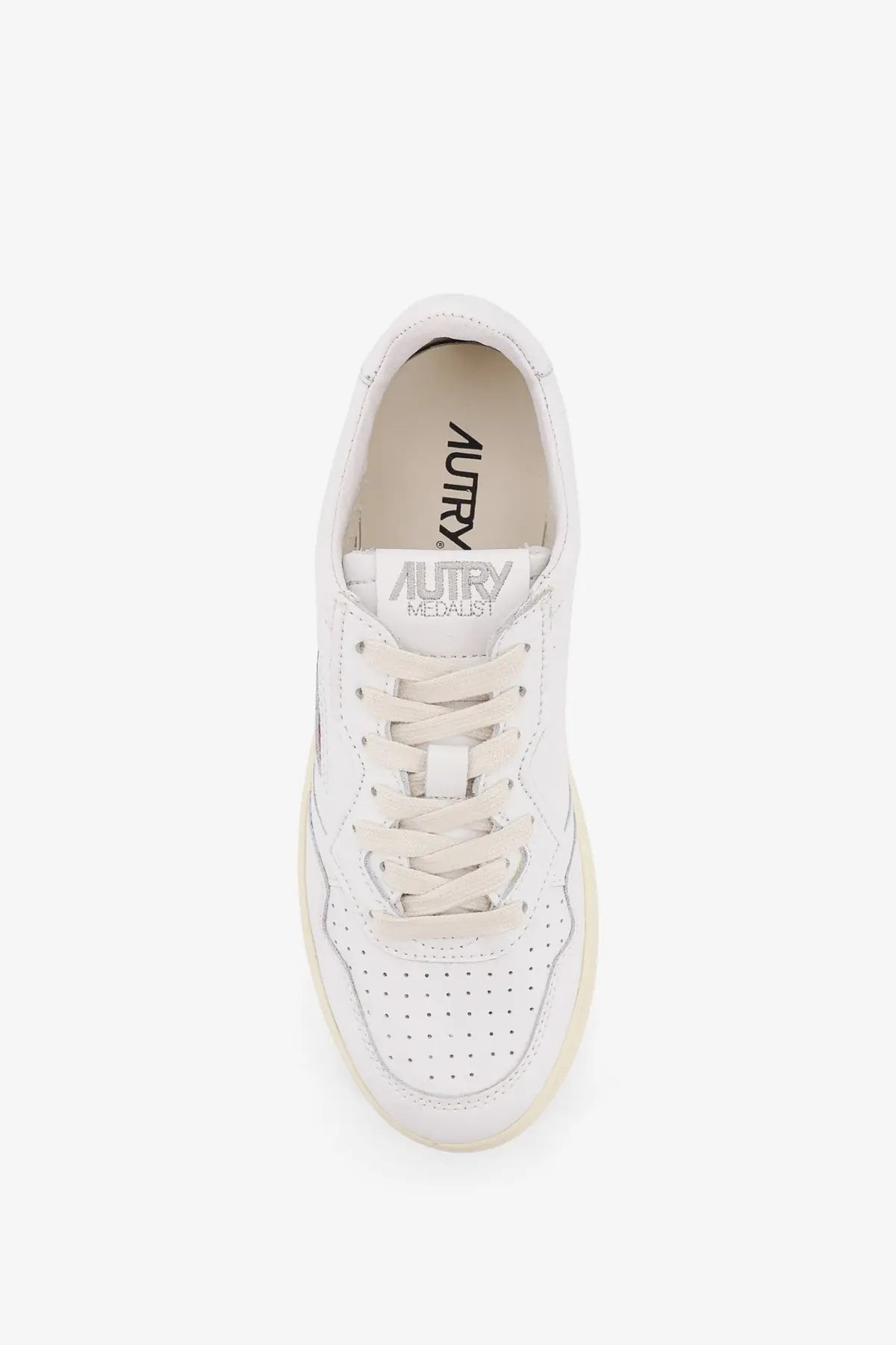 Autry women’s medalist low leather sneaker in white with perforated detailing and cream rubber sole