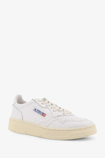 Autry women’s medalist low leather sneaker white with cream rubber sole and small embroidered side logo