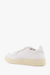 Autry women’s medalist low leather low top sneakers in white with cream rubber sole and perforated toe detailing