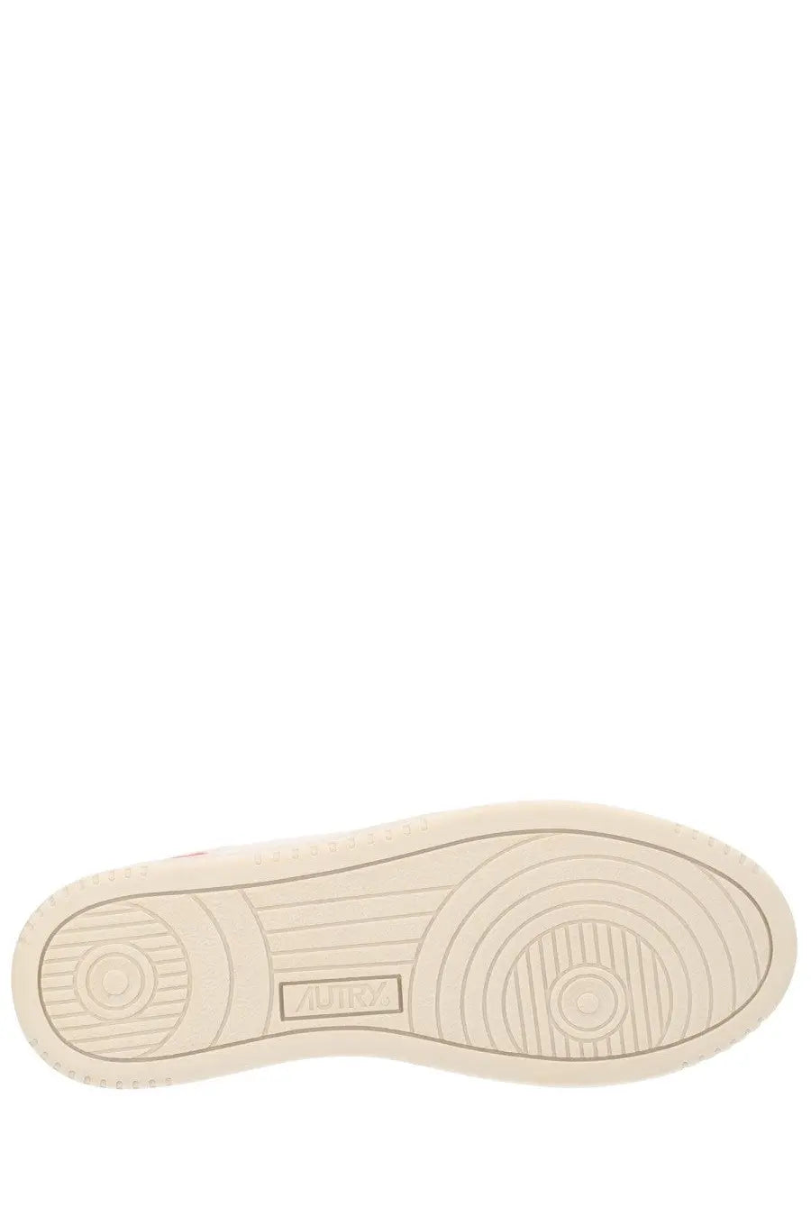 Cream-colored rubber sole with concentric circular tread and rectangular brand logo on autry women’s medalist low sneaker