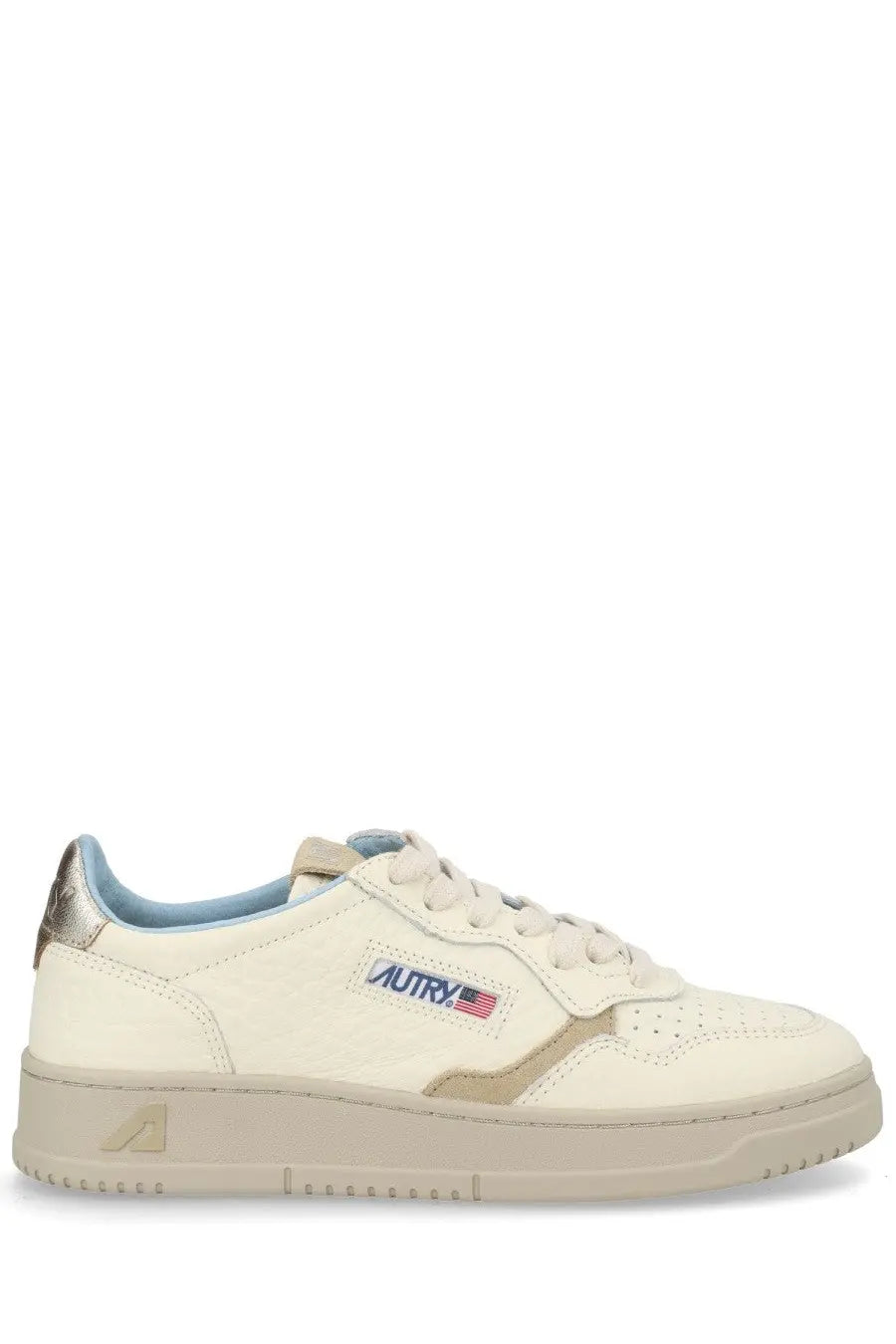 Cream-colored suede autry women’s medalist low sneaker with light blue accents and metallic heel tab with logo patch