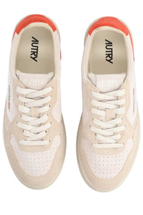 Autry women’s medalist low sneaker in cream suede and perforated leather with vibrant orange rubber heel tab