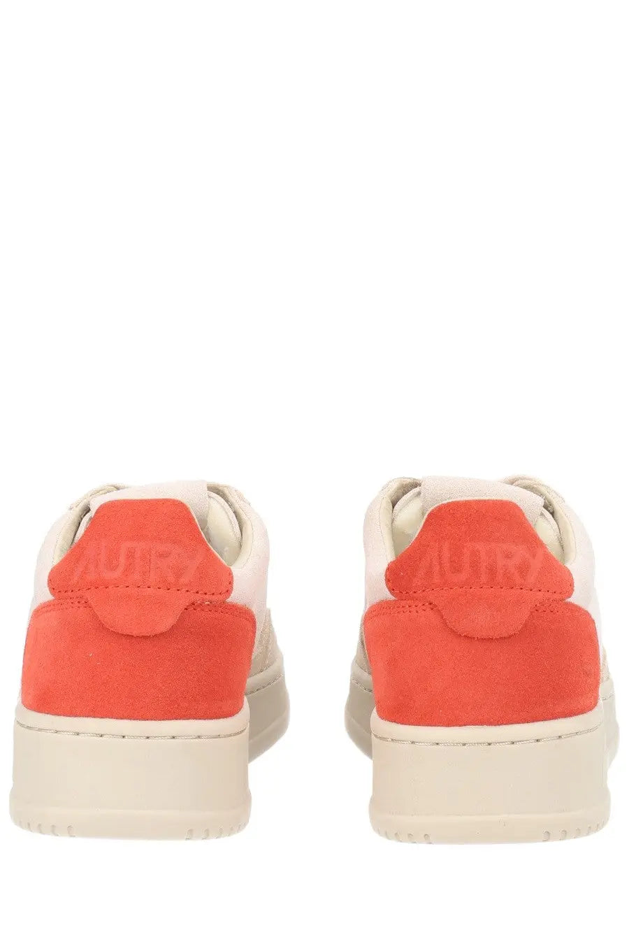 Back view of autry women’s medalist low sneaker in cream and coral suede with minimalist design and mutry embossed heel