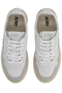 Autry women’s medalist low sneaker in white with beige perforated leather uppers and suede accents