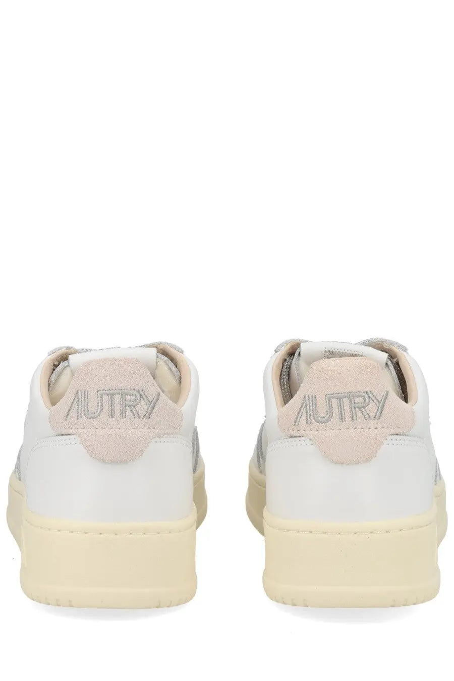 Back view of autry women’s medalist low sneaker white with beige suede heel tab and silver embroidered brand name