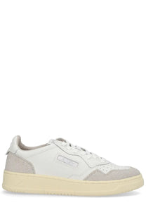 Autry women’s Medalist low sneaker in white featuring beige suede and leather with a cream rubber sole