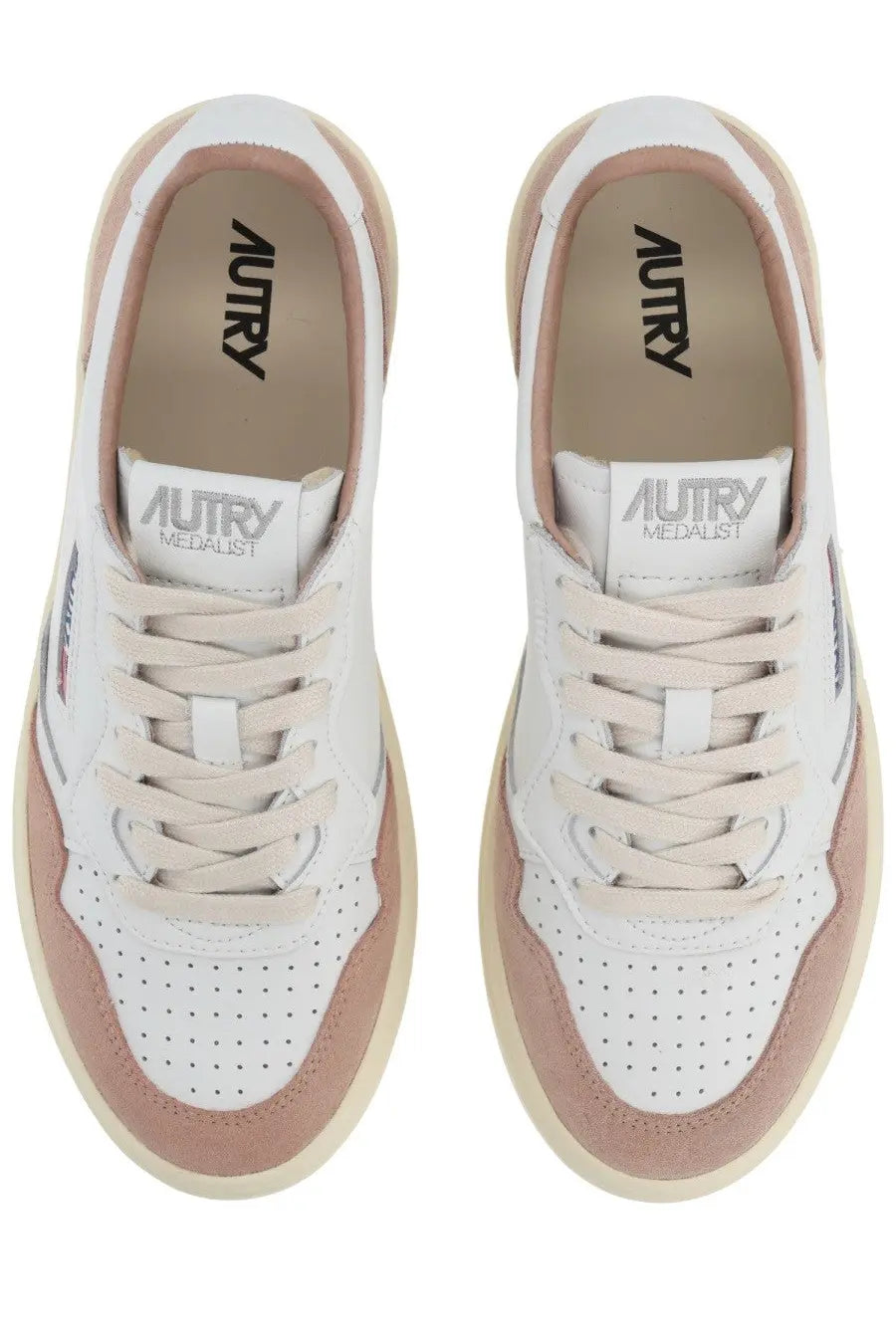 Autry women’s Medalist low sneaker in white with blush pink suede and leather featuring perforated detailing