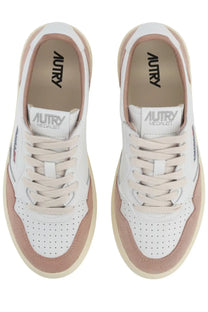 Autry women’s Medalist low sneaker in white with blush pink suede and leather featuring perforated detailing