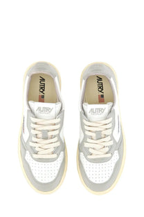 Autry women’s Medalist low sneaker in white and gray with perforated leather uppers cream laces and chunky sole