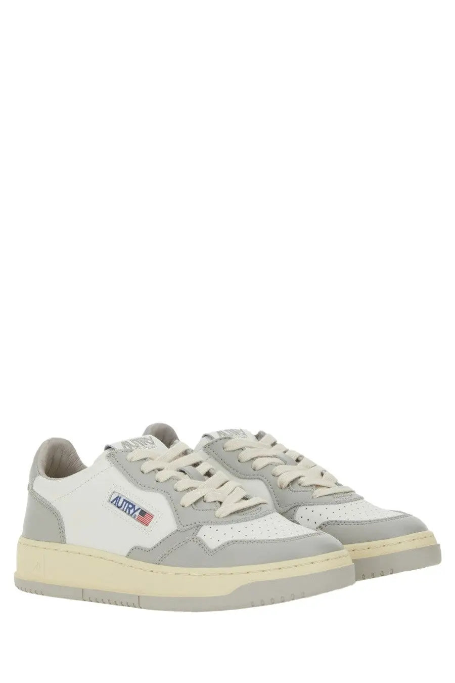 Autry women’s Medalist low sneaker in white and gray with cream rubber sole and Autry logo patch on the side