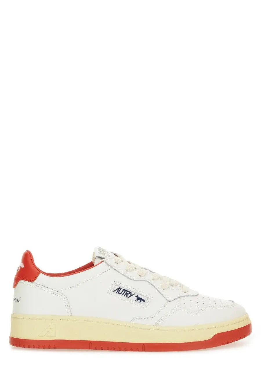 Autry women’s Medalist low sneaker in white leather with red accents and a black logo patch on the tongue