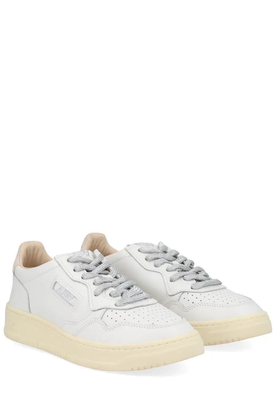 Autry women’s medalist low sneaker is a white leather sneaker with gray laces and a cream rubber sole