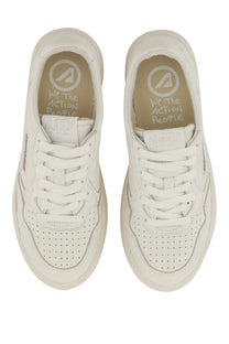 Autry women’s medalist low sneaker white leather with perforated detailing and we the action people branded insole