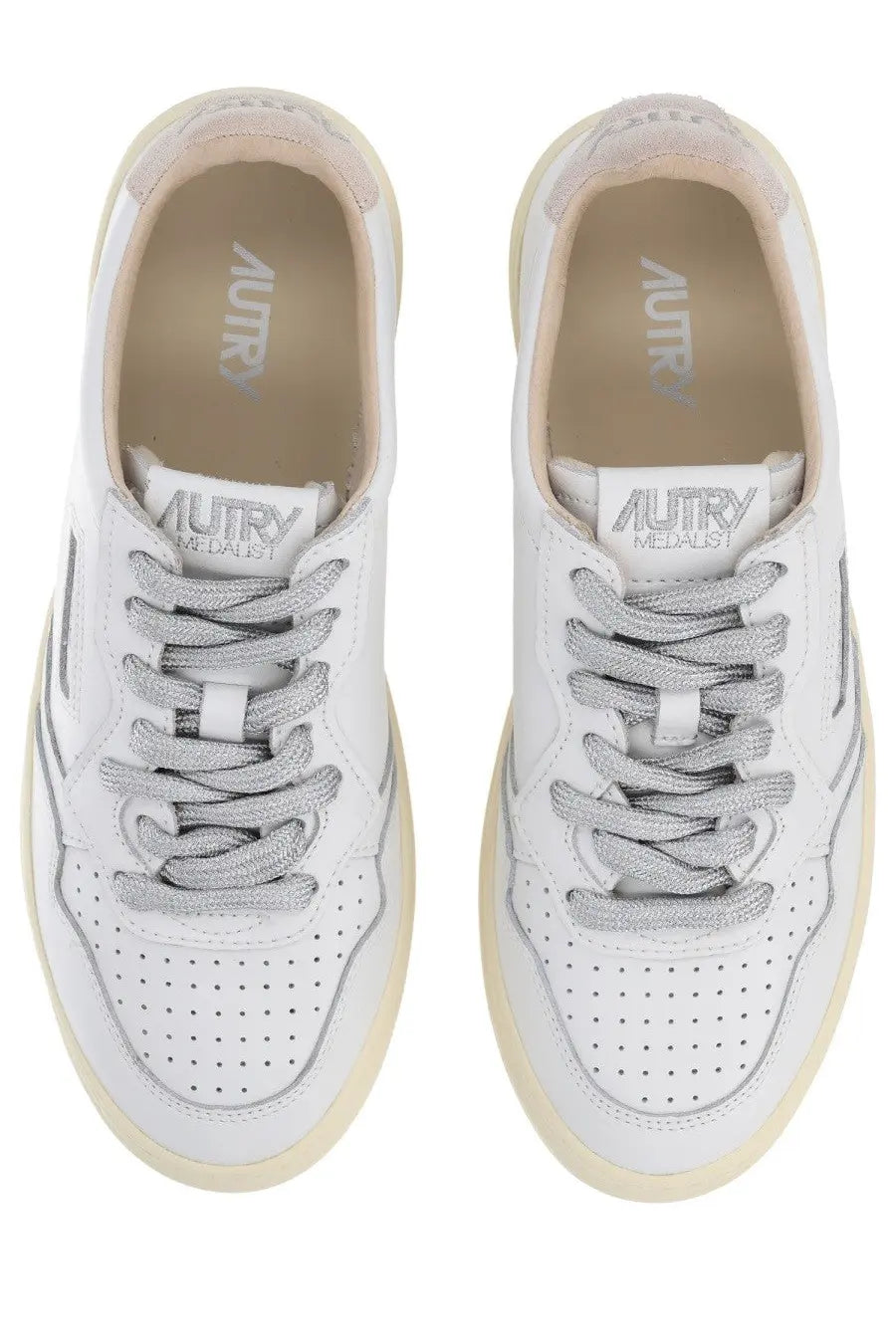 Autry women’s medalist low sneaker in white leather with silver laces cream sole and perforated toe box detailing