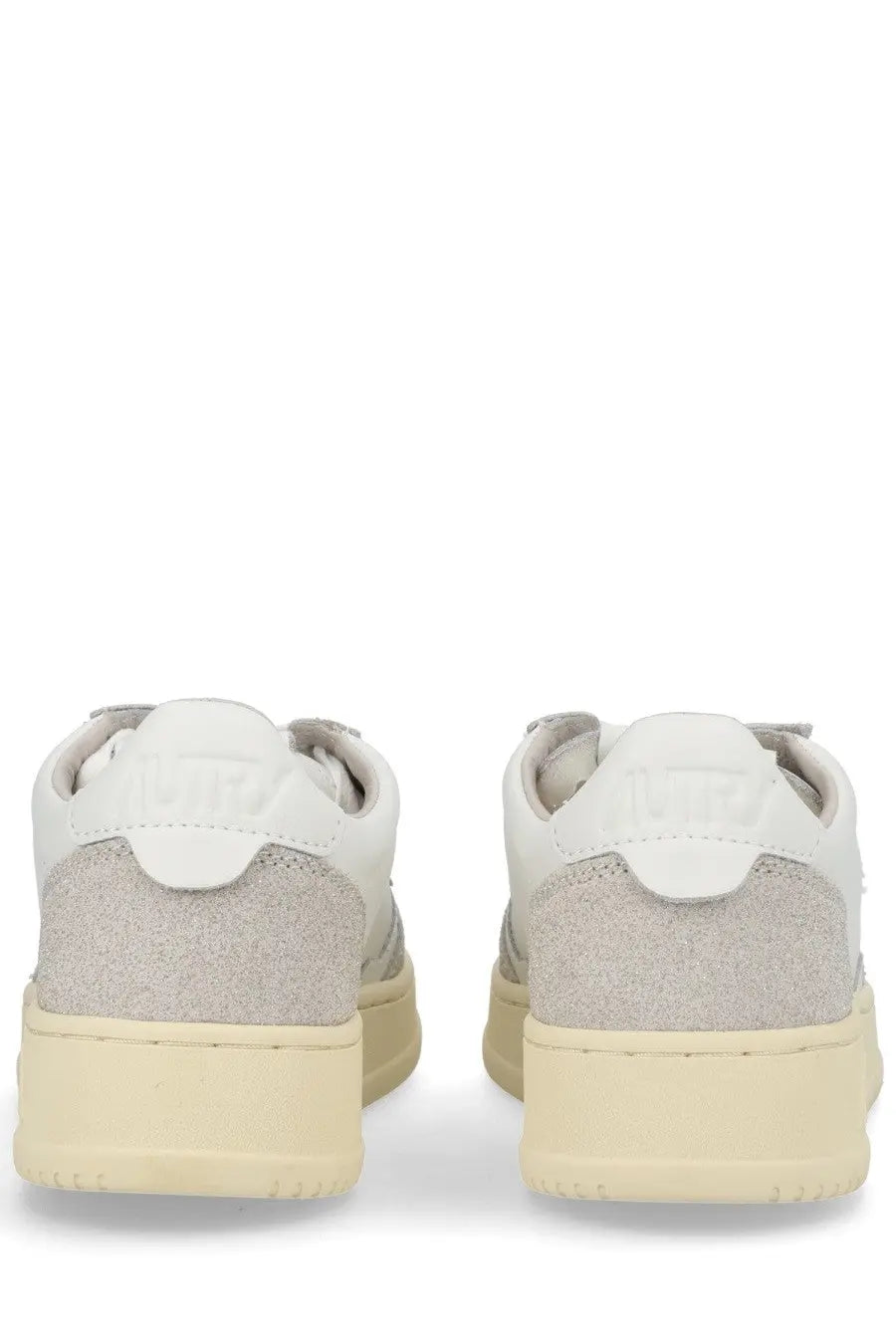 Autry women’s medalist low sneaker in white and light gray suede with cream rubber sole for casual wear
