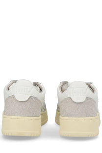 Autry women’s medalist low sneaker in white and light gray suede with cream rubber sole for casual wear