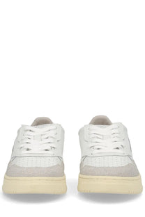 Autry women’s medalist low sneaker in white with light gray suede and perforated toe box detailing