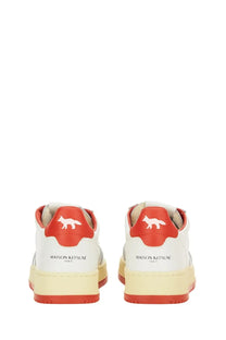 Back side of autry women’s medalist low sneaker in white and red with fox logo on heel