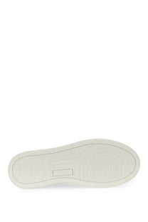 Autry women’s medalist low sneaker white with white rubber sole featuring subtle circular tread and rectangular brand logo imprint