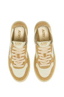 Autry women’s Medalist low sneaker in yellow tan and cream suede with perforated white leather panels and branded insole
