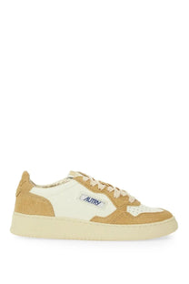 Autry women’s Medalist low sneaker in tan and white suede with cream rubber sole and yellow accents