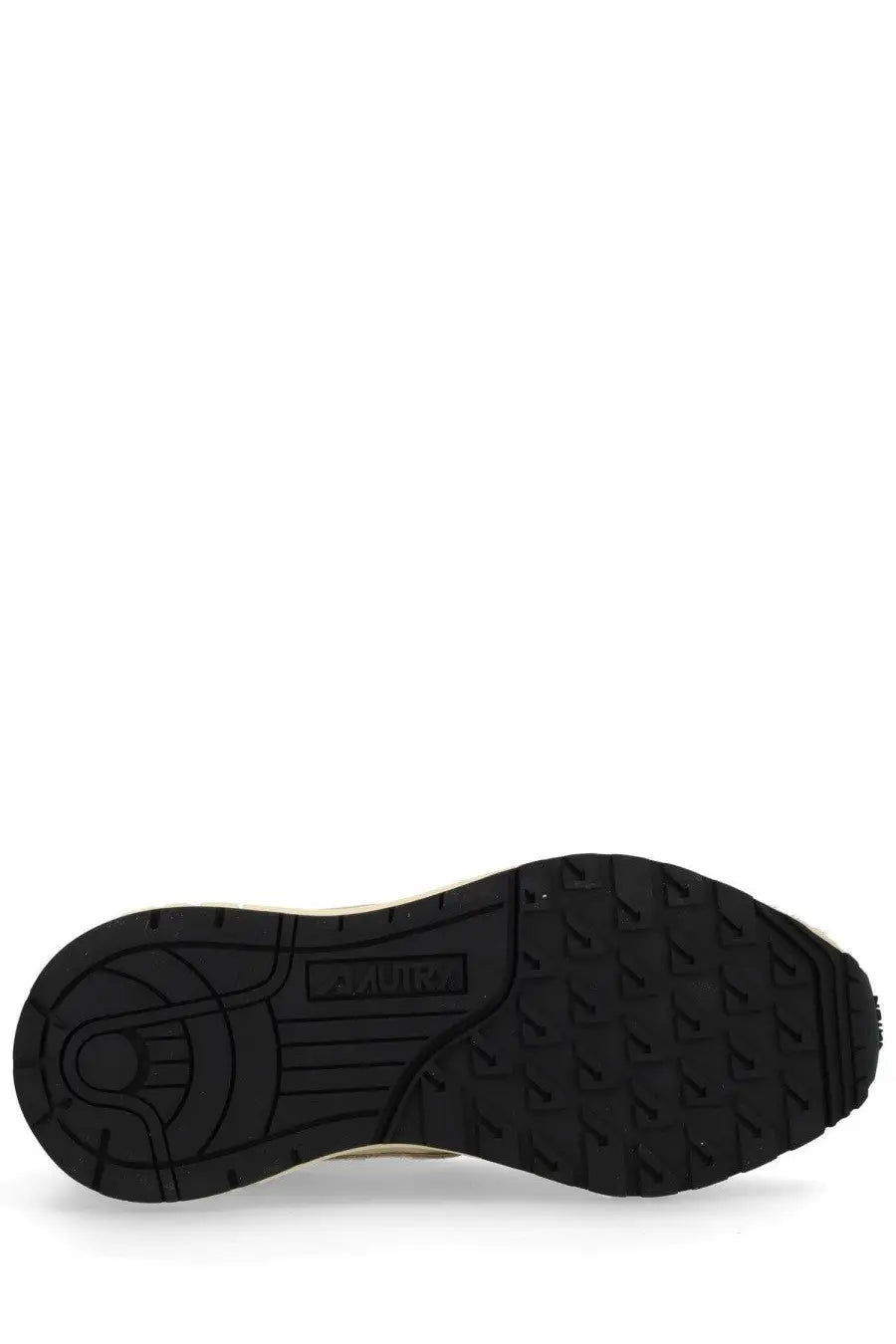 Black rubber sole with textured tread and embossed brand logo on autry women reelwind low sneaker pink
