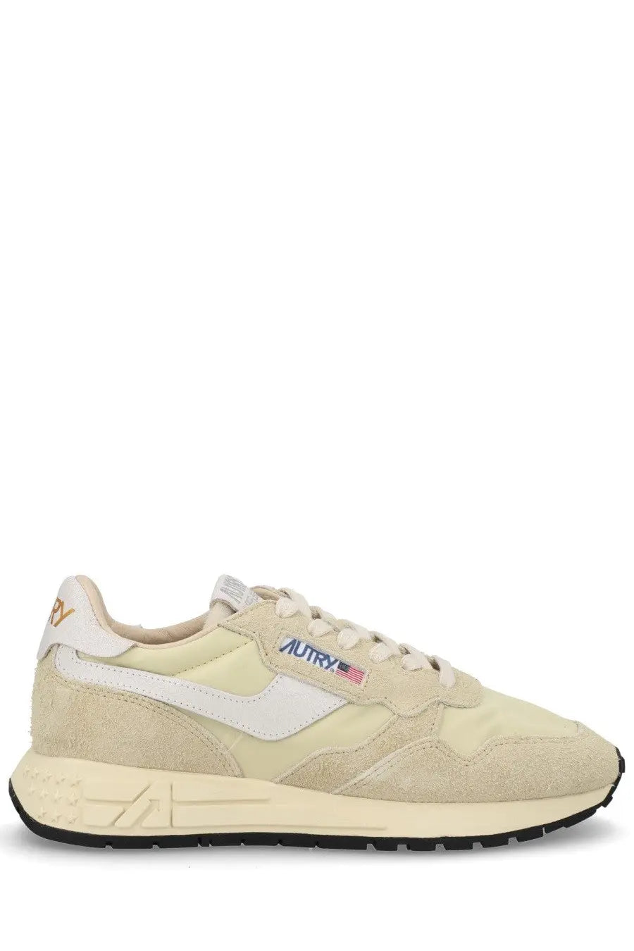 Autry women’s reelwind low sneaker in cream suede and canvas with white accents and subtle logo patch on the side