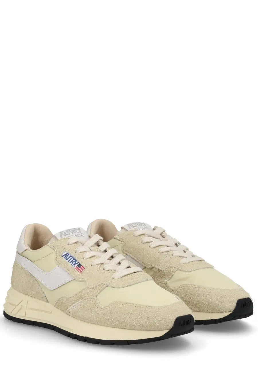 Autry women’s reelwind low sneaker in cream suede and canvas with white swoosh and black rubber sole
