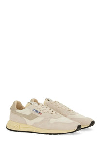 Autry women’s reelwind low sneaker white beige and cream suede with subtle american flag logo on the side