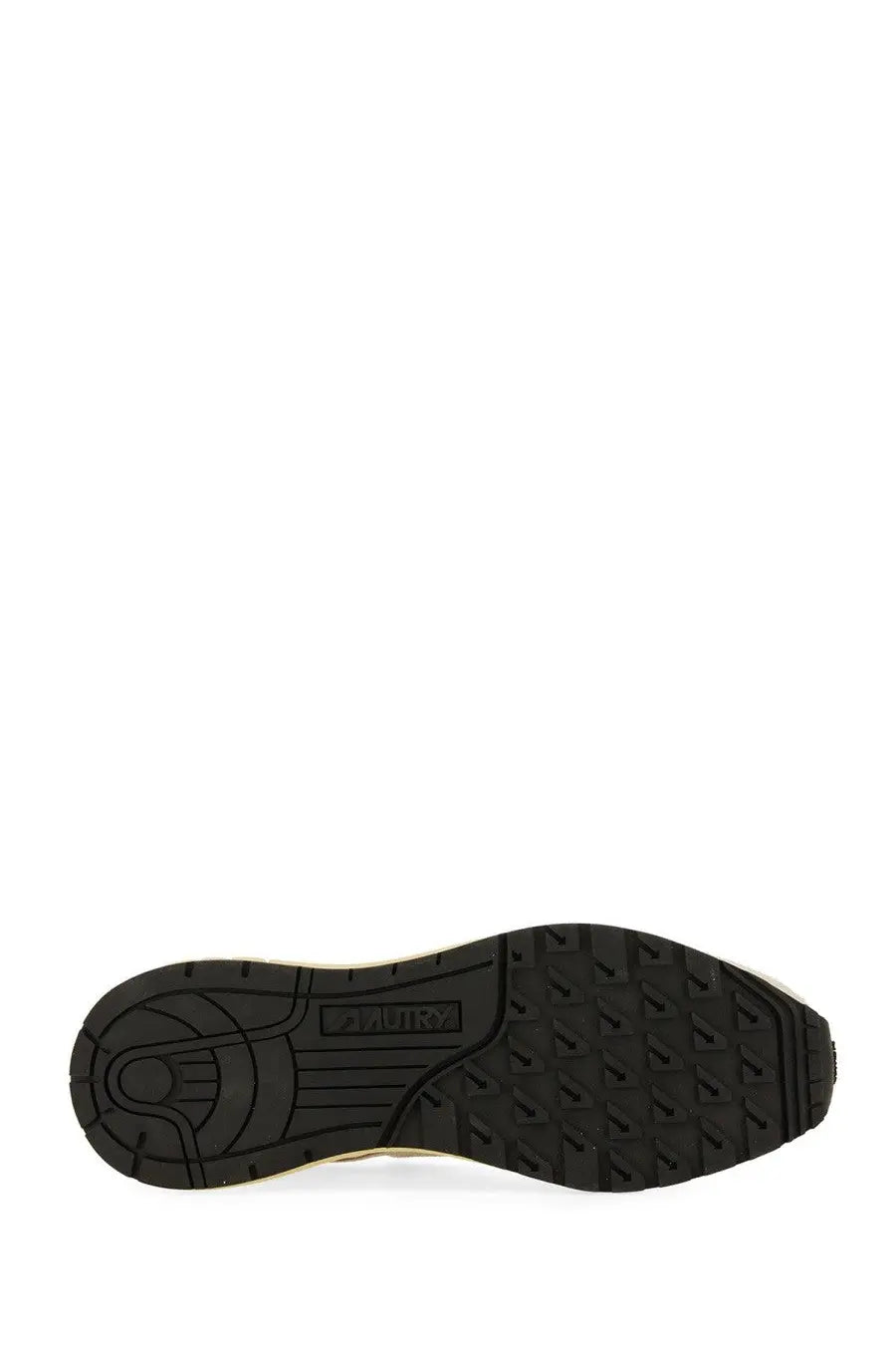 Black rubber sole with textured tread and alden embossed on the side of autry women’s reelwind low sneaker white