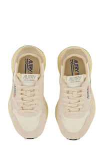 Autry women’s reelwind low sneaker in cream suede and canvas with chunky sole and branding on insole and side