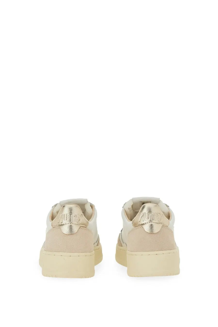 Beige autry women’s sneaker medalist low with metallic gold heel tabs and chunky rubber sole shown from the back side