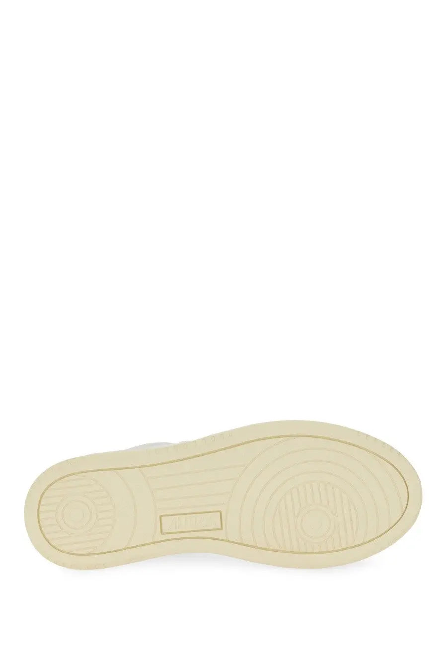 Cream-colored rubber sole with circular tread patterns and rectangular logo indentation on autry women’s sneaker medalist low multicolor