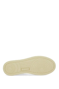 Cream-colored rubber sole with circular tread patterns and rectangular logo indentation on autry women’s sneaker medalist low multicolor