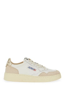 Autry women’s sneaker medalist low in white and beige suede with gold tone heel tab and blue red logo on the side