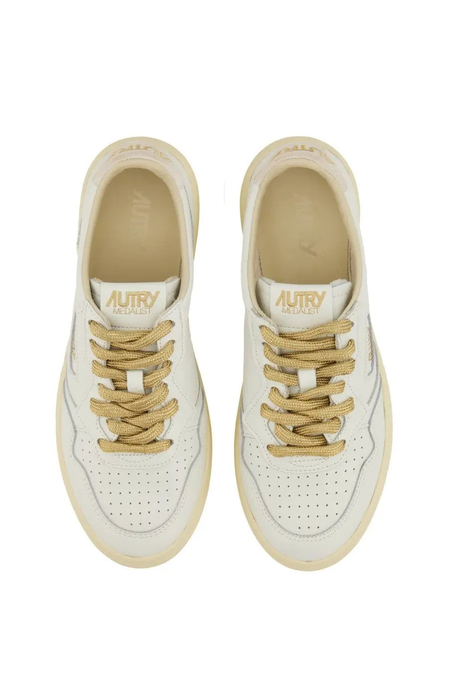 Autry women’s sneaker Medalist low in white leather with gold laces cream rubber sole and perforated upper detailing