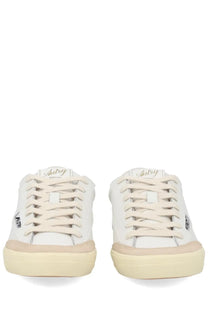 Autry women’s sneaker windscape low white with white canvas upper beige rubber soles and laces featuring subtle branding