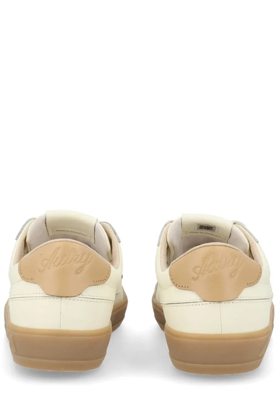 Autry women’s sneaker windscape low white featuring cream suede and leather with tan rubber soles and embossed logo on heel back