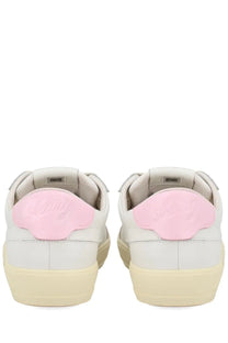 Autry women’s sneaker windscape low white with white leather, soft pink suede heel tab, and cream rubber soles showing back side