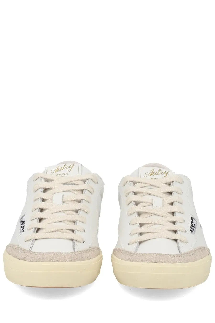 Autry women’s sneaker windscape low white leather with beige rubber soles laces and gold embroidery on the tongue