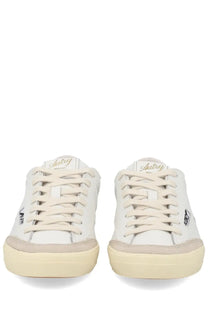 Autry women’s sneaker windscape low white leather with beige rubber soles laces and gold embroidery on the tongue