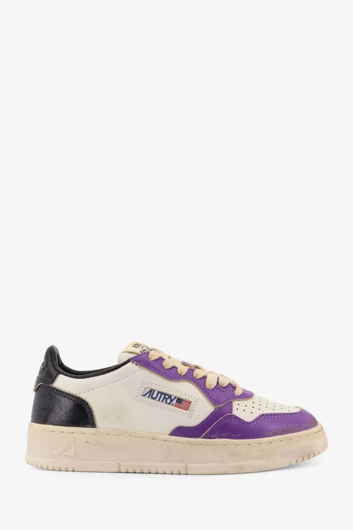 Autry women’s super vintage low top leather sneaker in purple and cream with black heel tab and perforated toe box