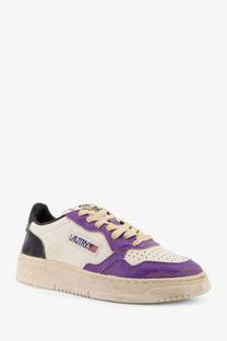 Autry women’s super vintage low top leather sneaker in purple cream with distressed leather and black heel tab
