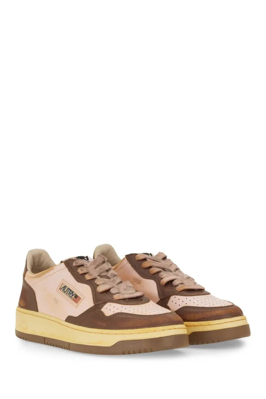 Autry women’s super vintage sneaker brown with brown and beige suede low tops and yellow rubber sole with aurora logo